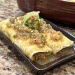 Sweet pork enchiladas on a plate.