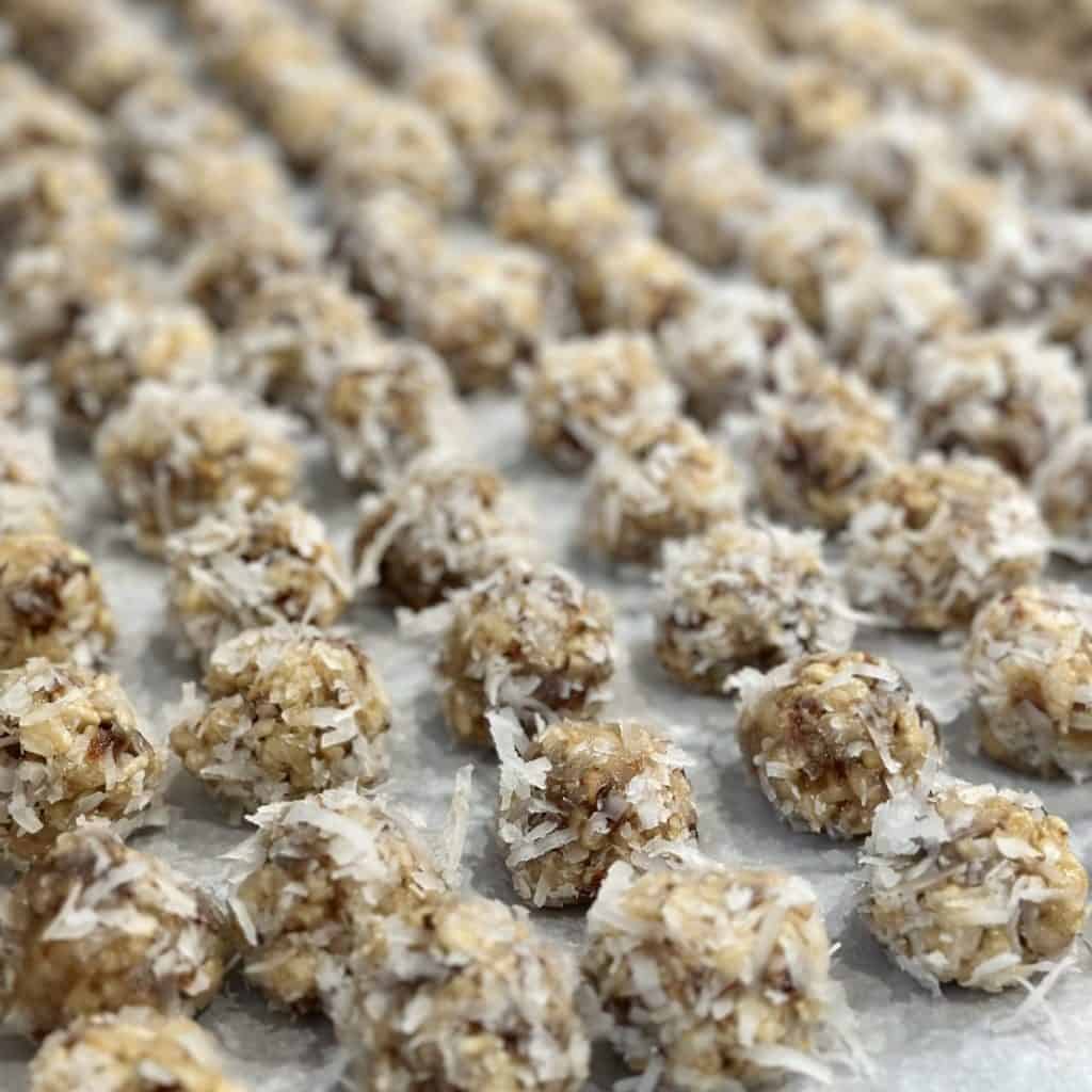 Date balls on parchment paper.