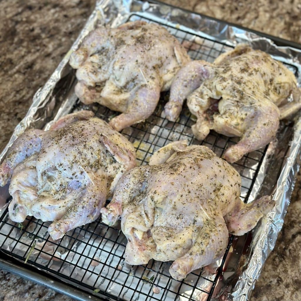 Cornish game hens ready to go in the oven to roast.