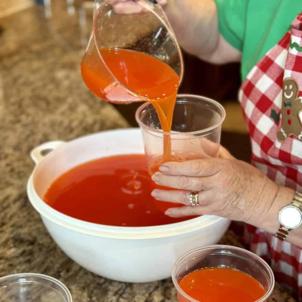 Adding punch to individual containers for freezing.