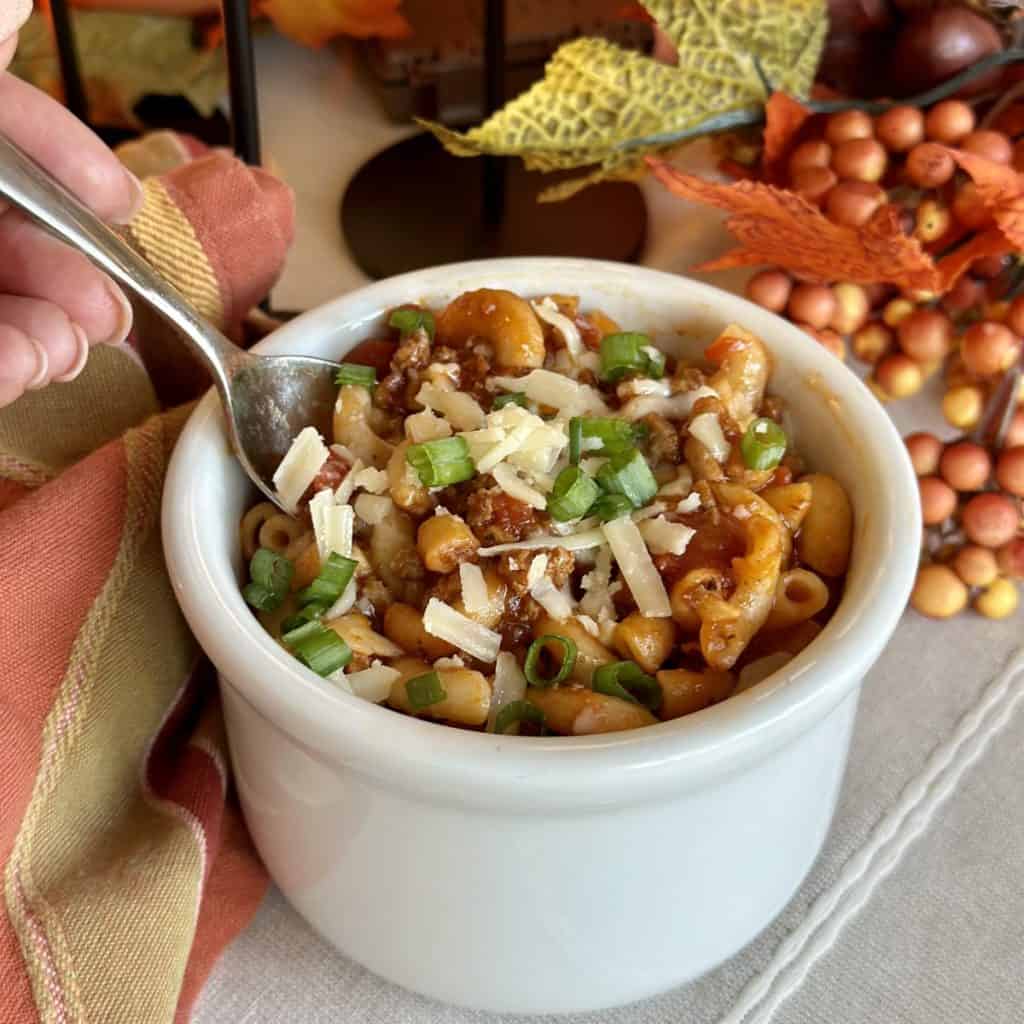 A bowl of beef and sausage goulash.