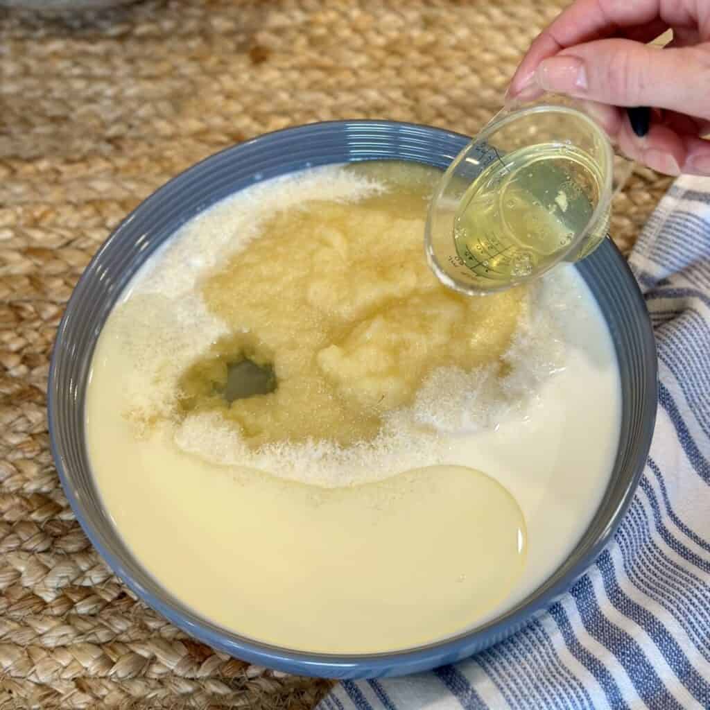 Mixing together wet ingredients for muffins.