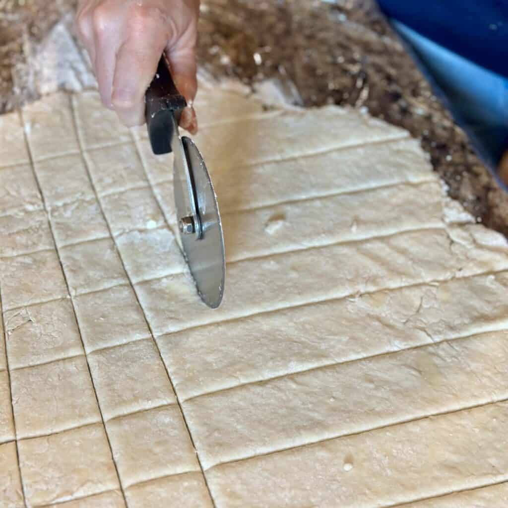 Cutting dumplings on the counter.