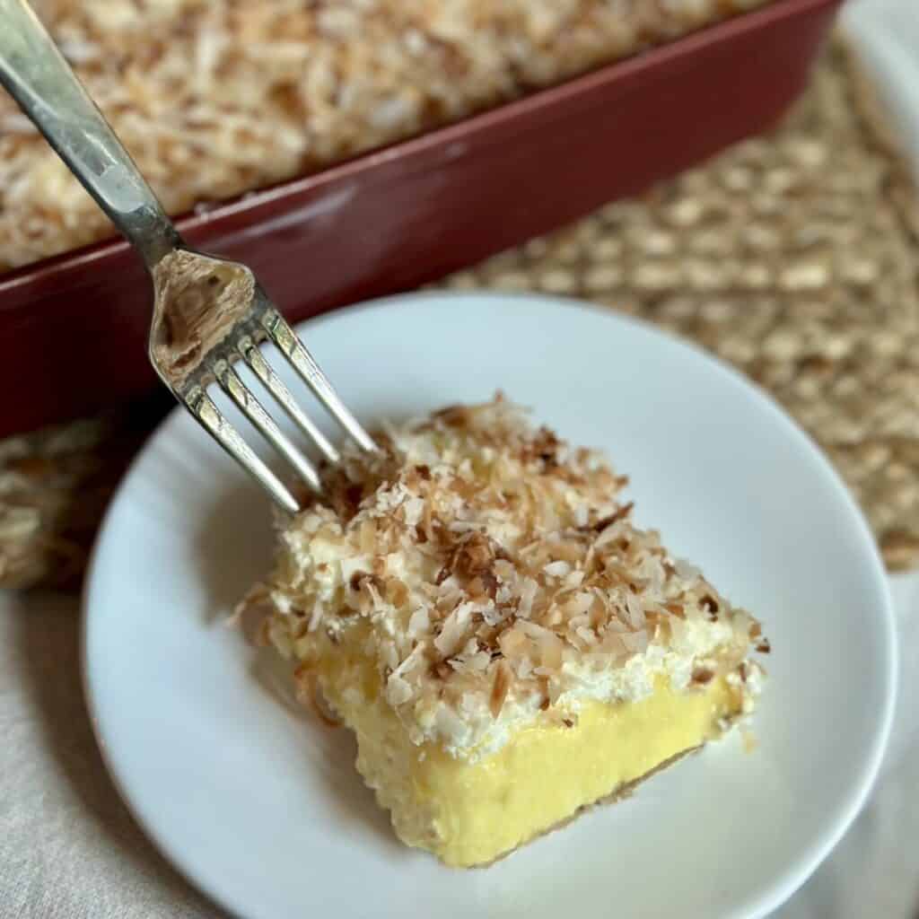 Getting a fork bite of no bake coconut cream pie.