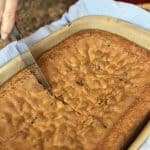 Cutting a slice of sad cake.