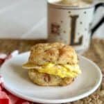 An egg biscuit on a plate.