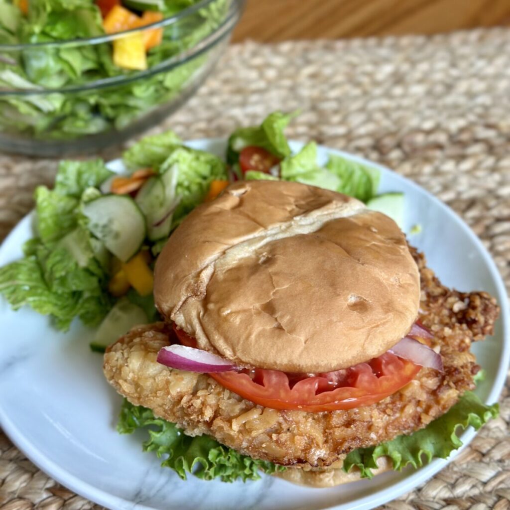 A fried pork tenderloin sandwich.