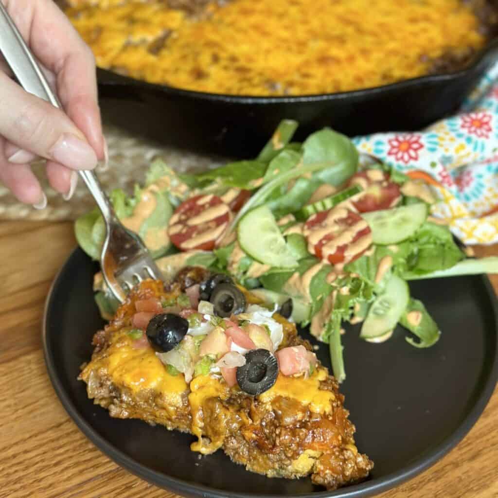 Getting a bite of beef tamale pie on a fork.