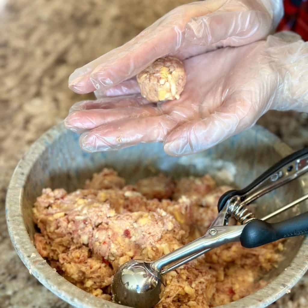 Rolling a sausage ball