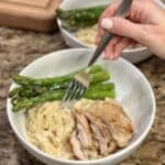 A fork getting a bite of pasta.