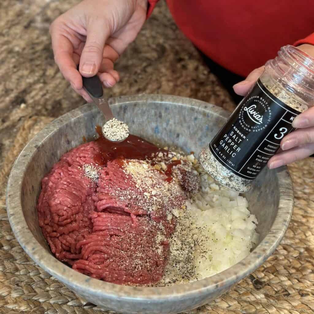 The ingredients in a bowl to make meatloaf.