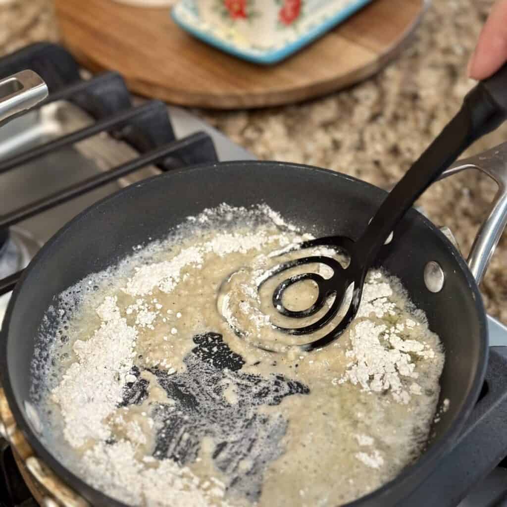 Making gravy in a skillet.