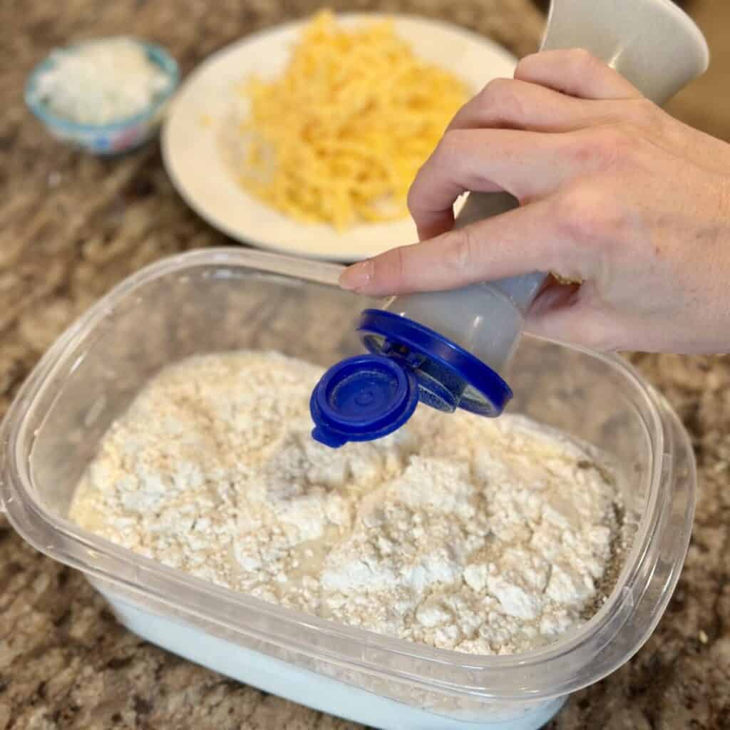 Mixing together the egg filler for casserole.