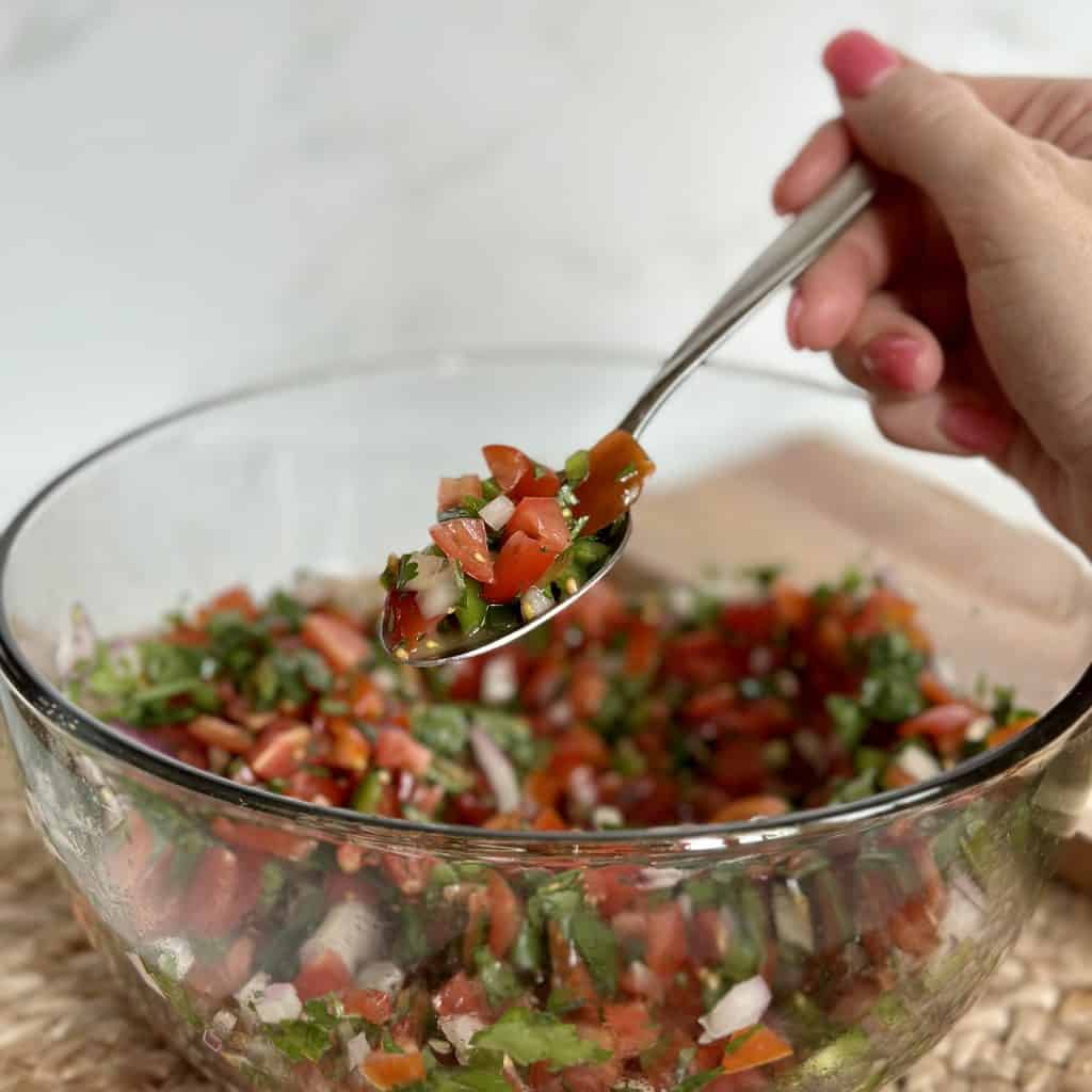 a bowl full of prepared pico de gallo