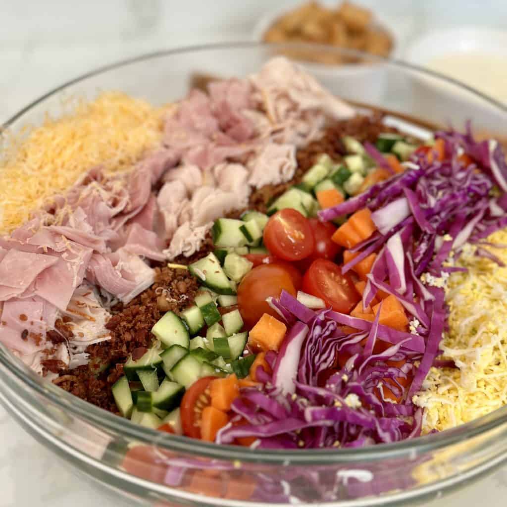 club salad displayed in a glass bowl