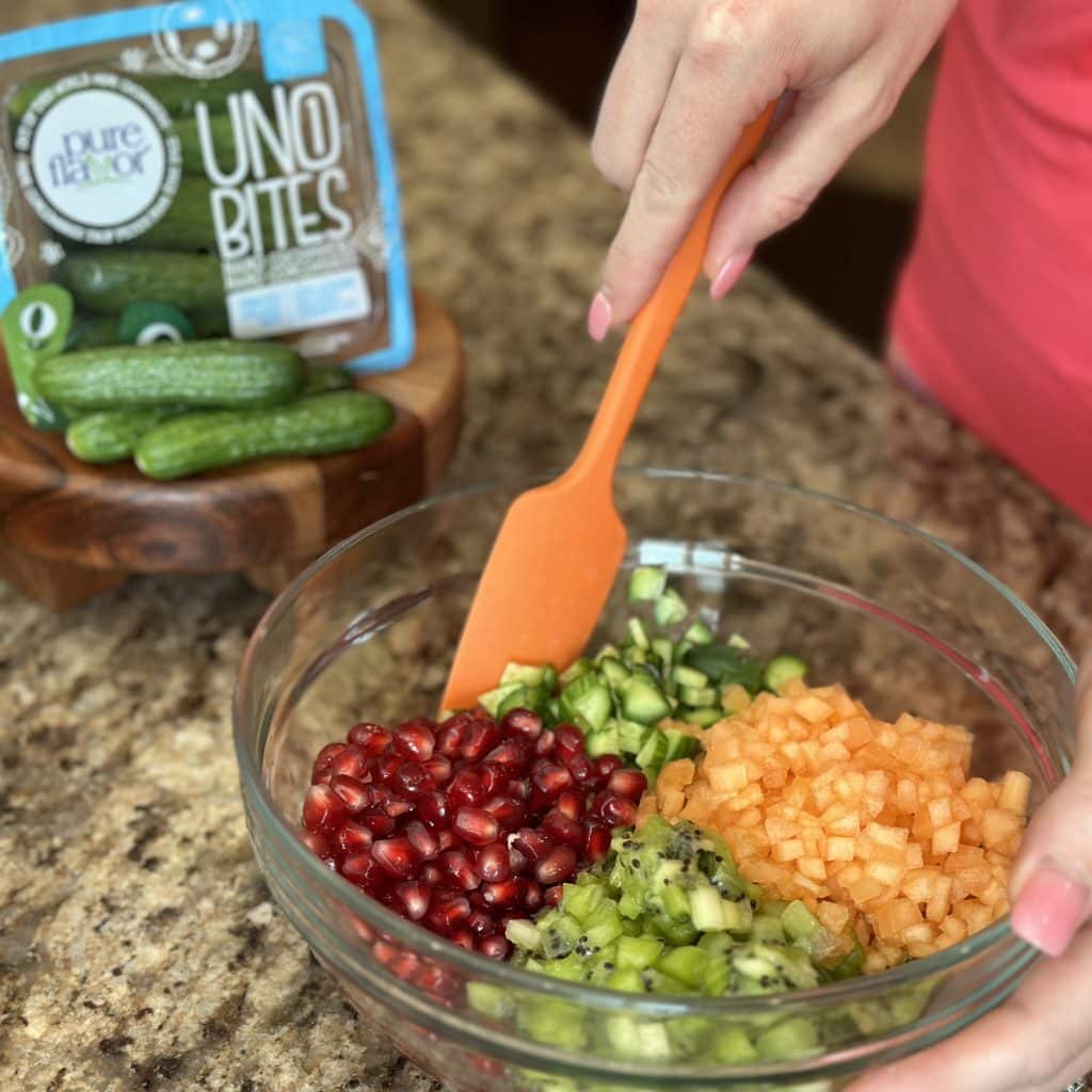 stirring ingredients in a glass bowl