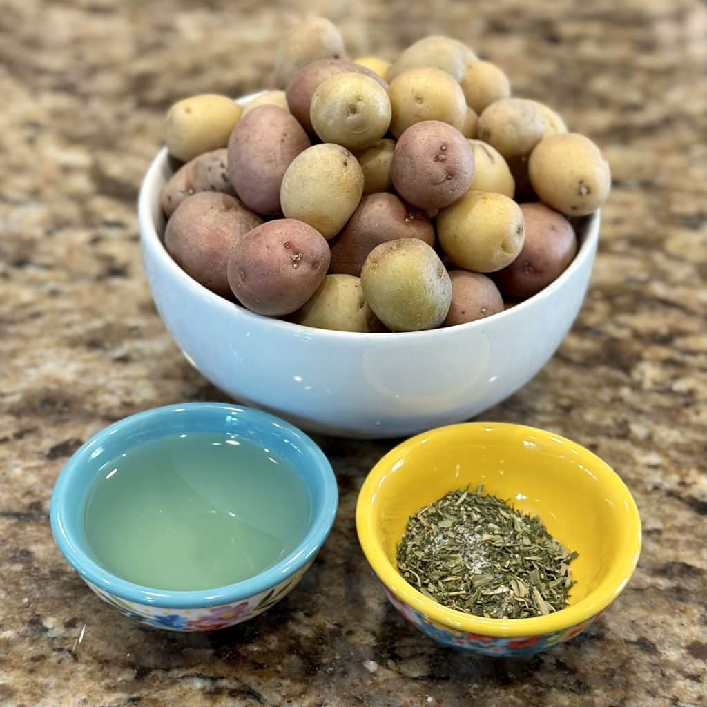 Potatoes and seasonings displayed on a counter top