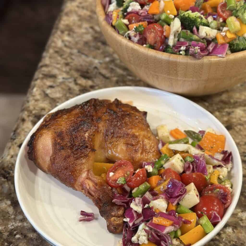 A plate of chicken and vegetables.