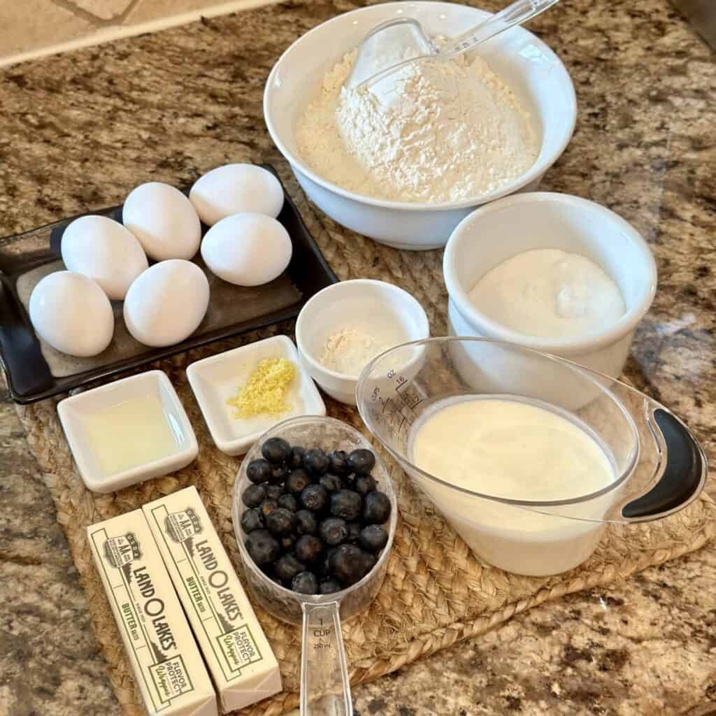 The ingredients to make a lemon blueberry pound cake.