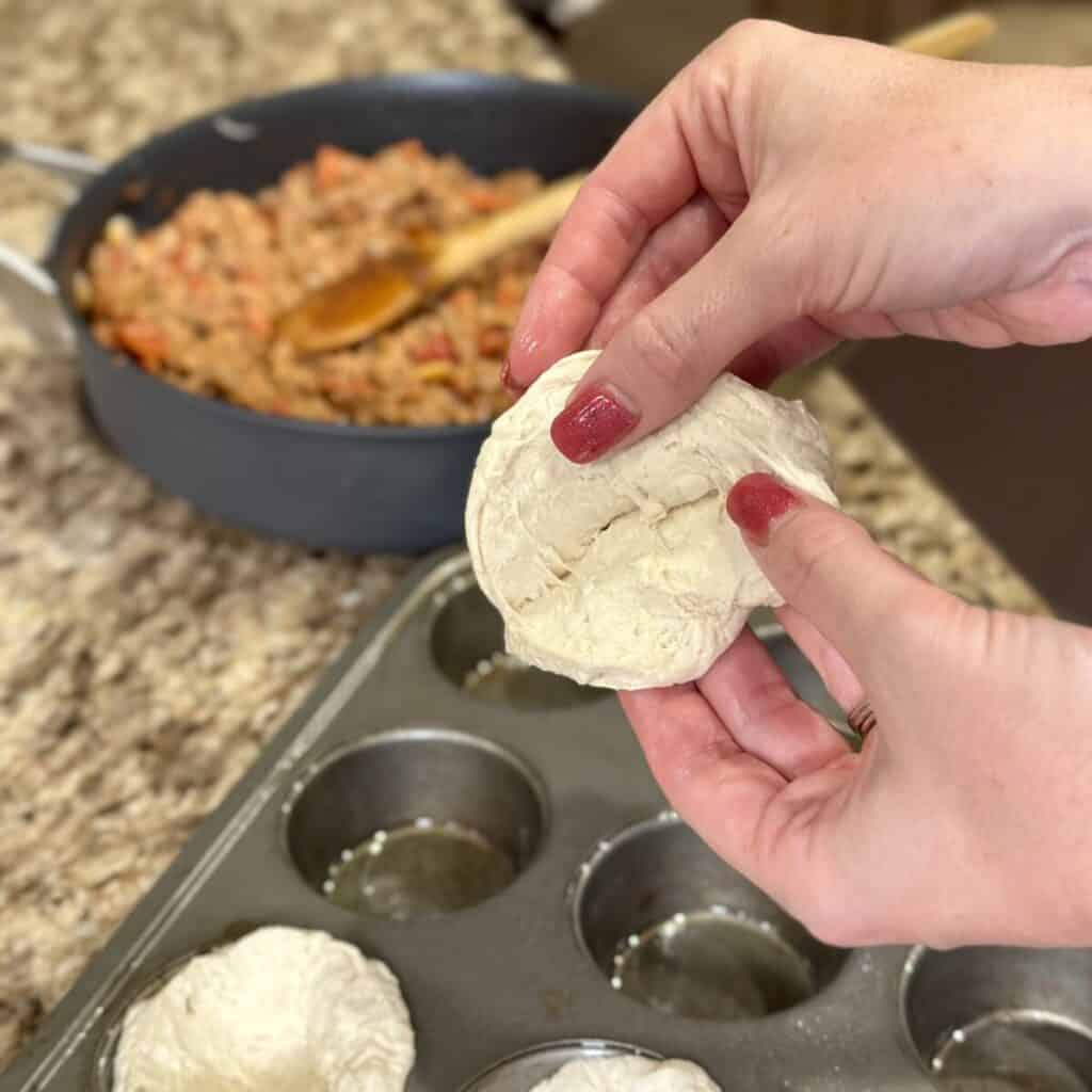 Splitting a biscuit in half.