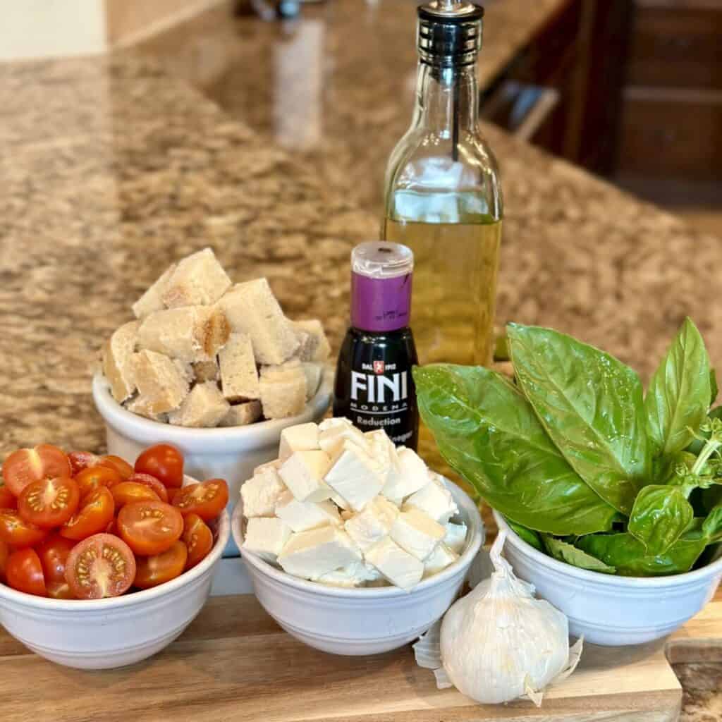 The ingredients to make caprese panzanella.