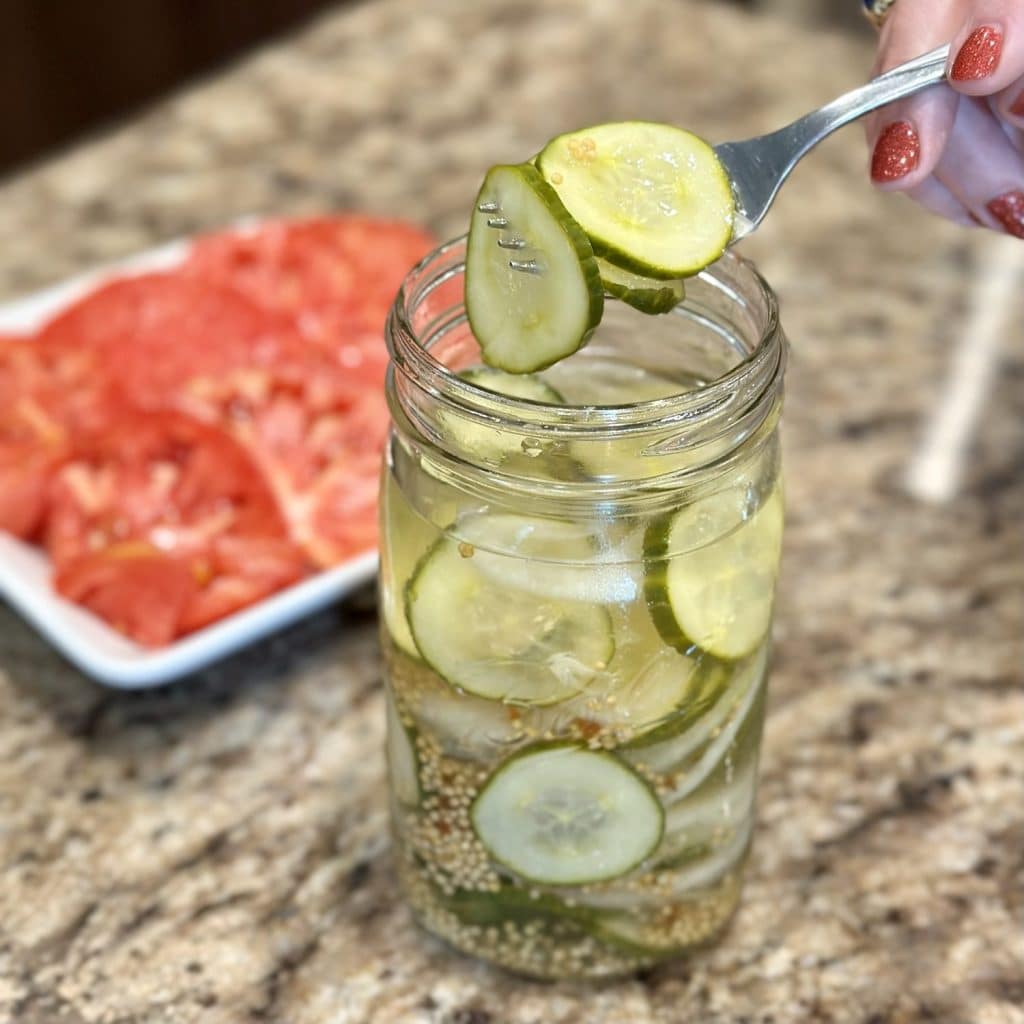 Homemade overnight pickles in a jar.