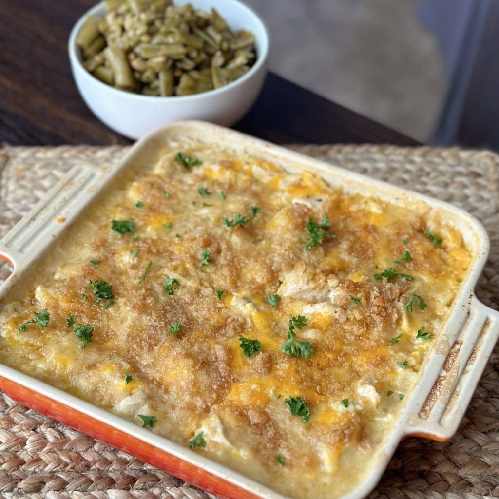 A baking dish filled with a chicken and rice casserole.