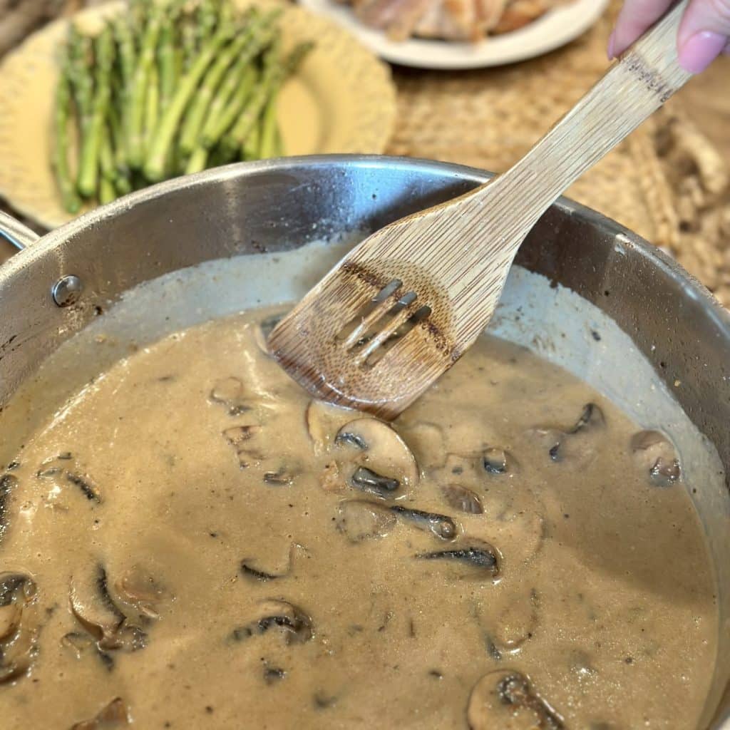 Stirring together a gravy in a skillet.