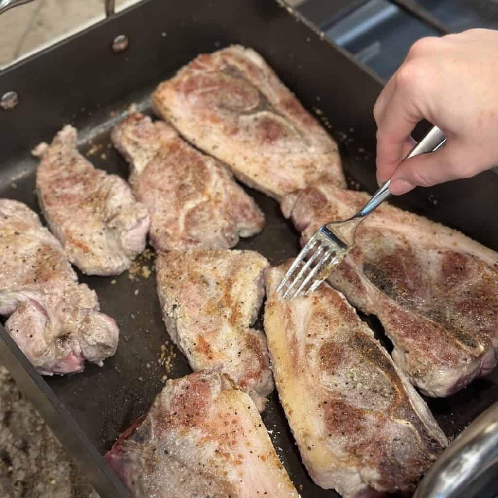 Searing ribs in a skillet.