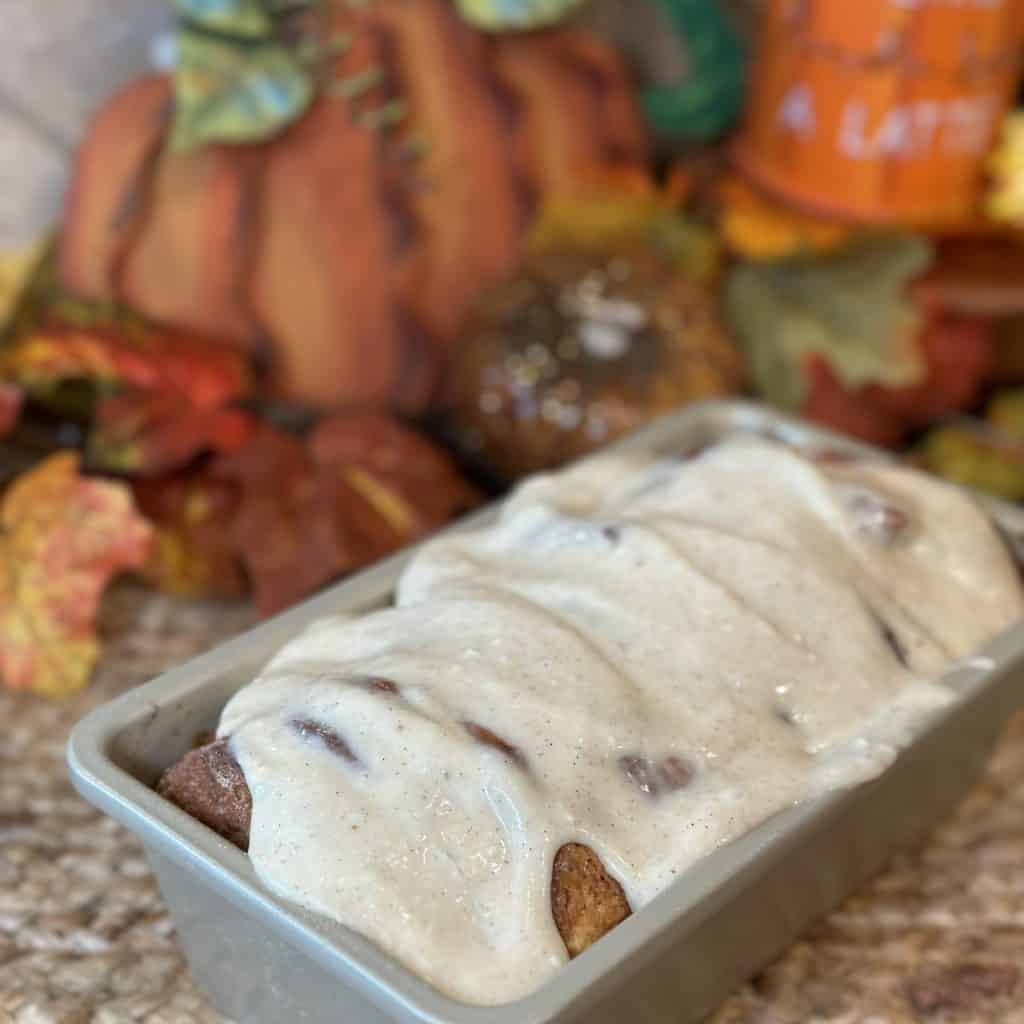 A pull apart loaf with glaze on top.