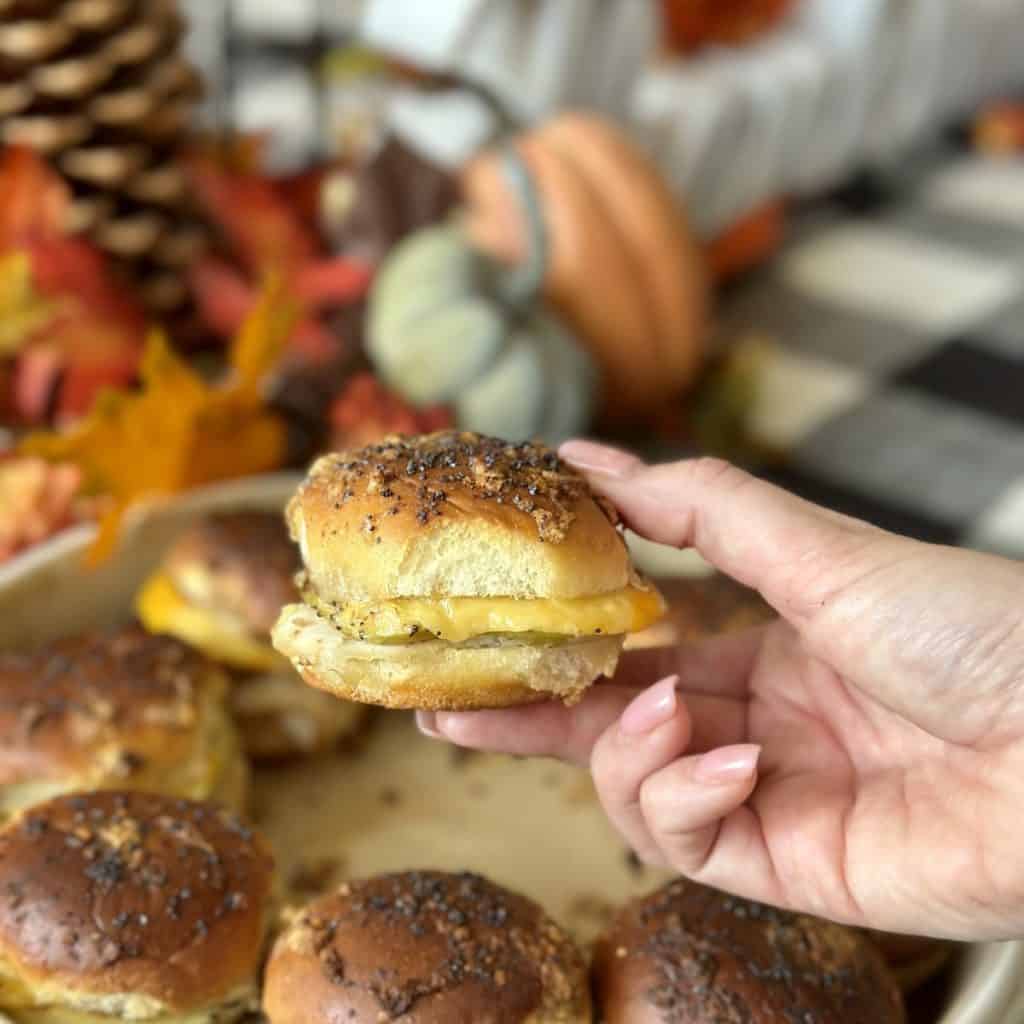 Holding a turkey slider.