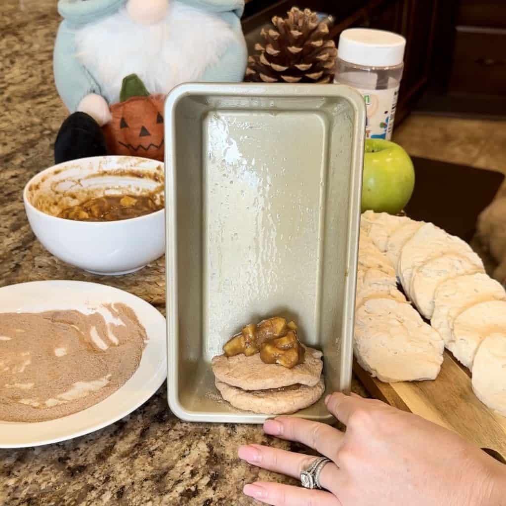 Layers of biscuit dough and apple butter filling.