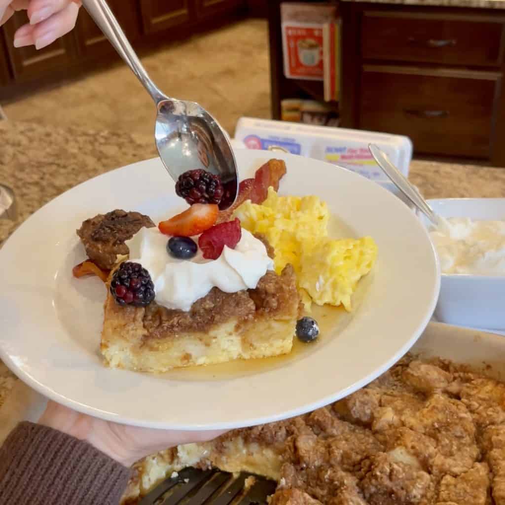 A plate of French toast and scrambled eggs.