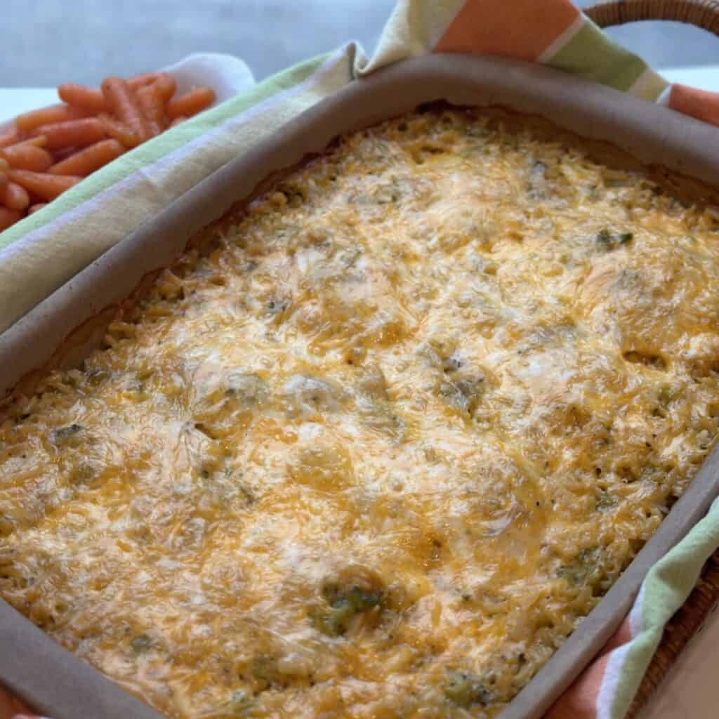 A pan of cheesy broccoli chicken and rice casserole.