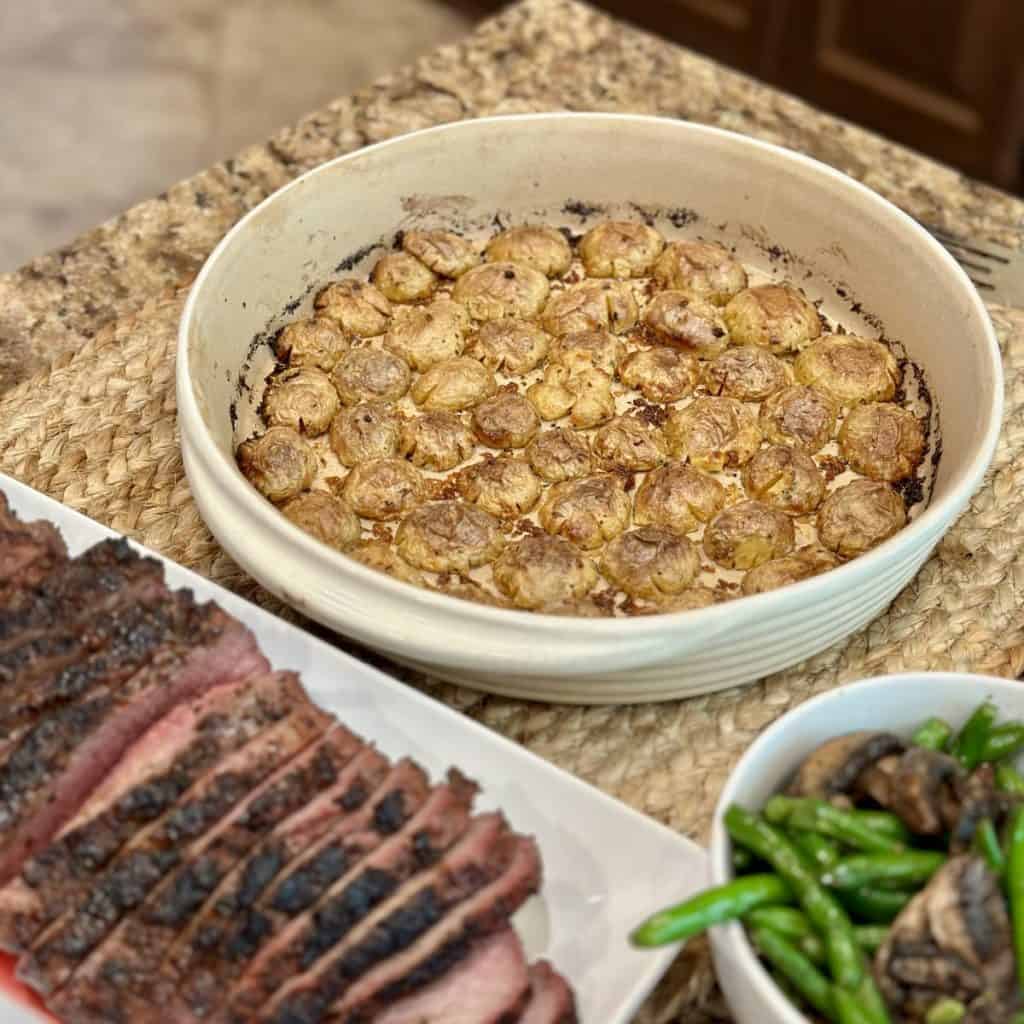 A displayed dinner of potatoes, beef and green beans.