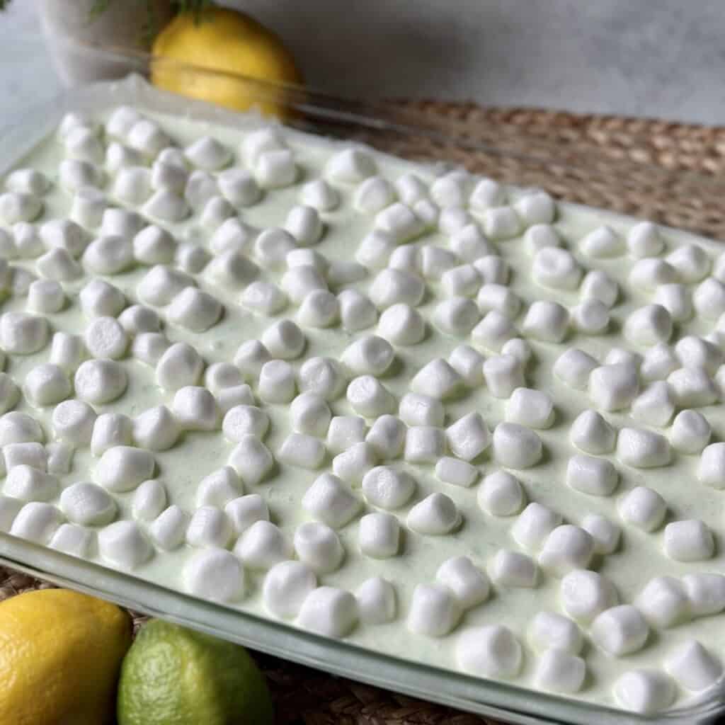 A pineapple jello salad in a dish.