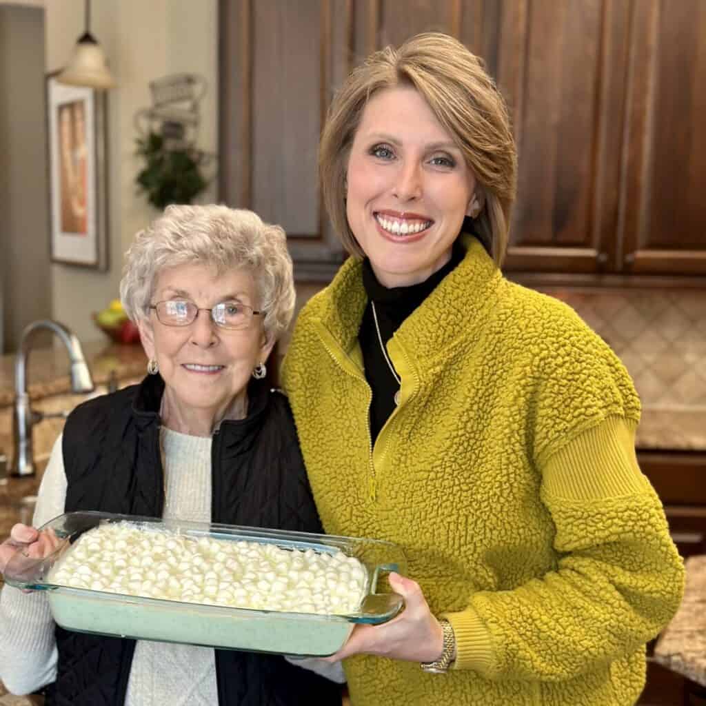 Mamaw and Laura Ashley holding pineapple salad.