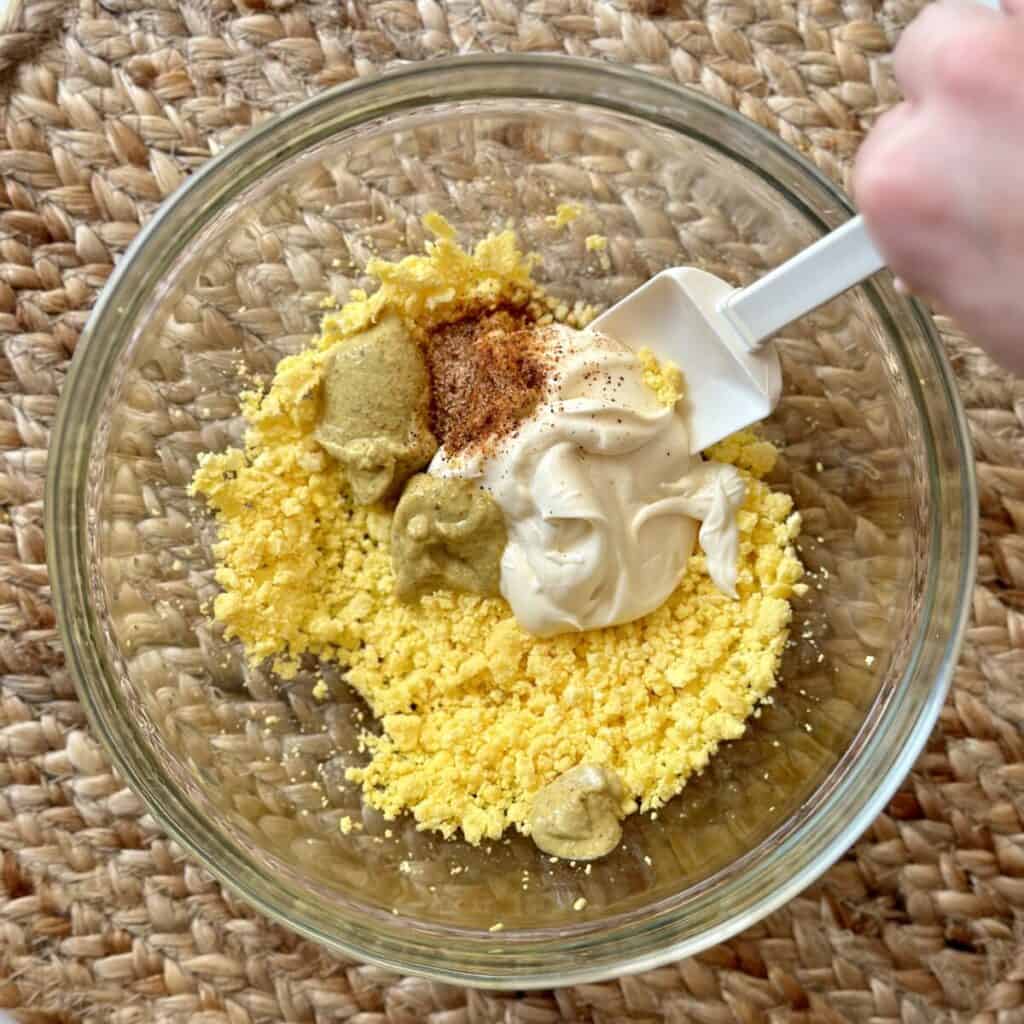 Making the filling for deviled eggs.