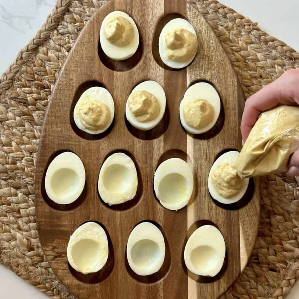 Filling deviled eggs.