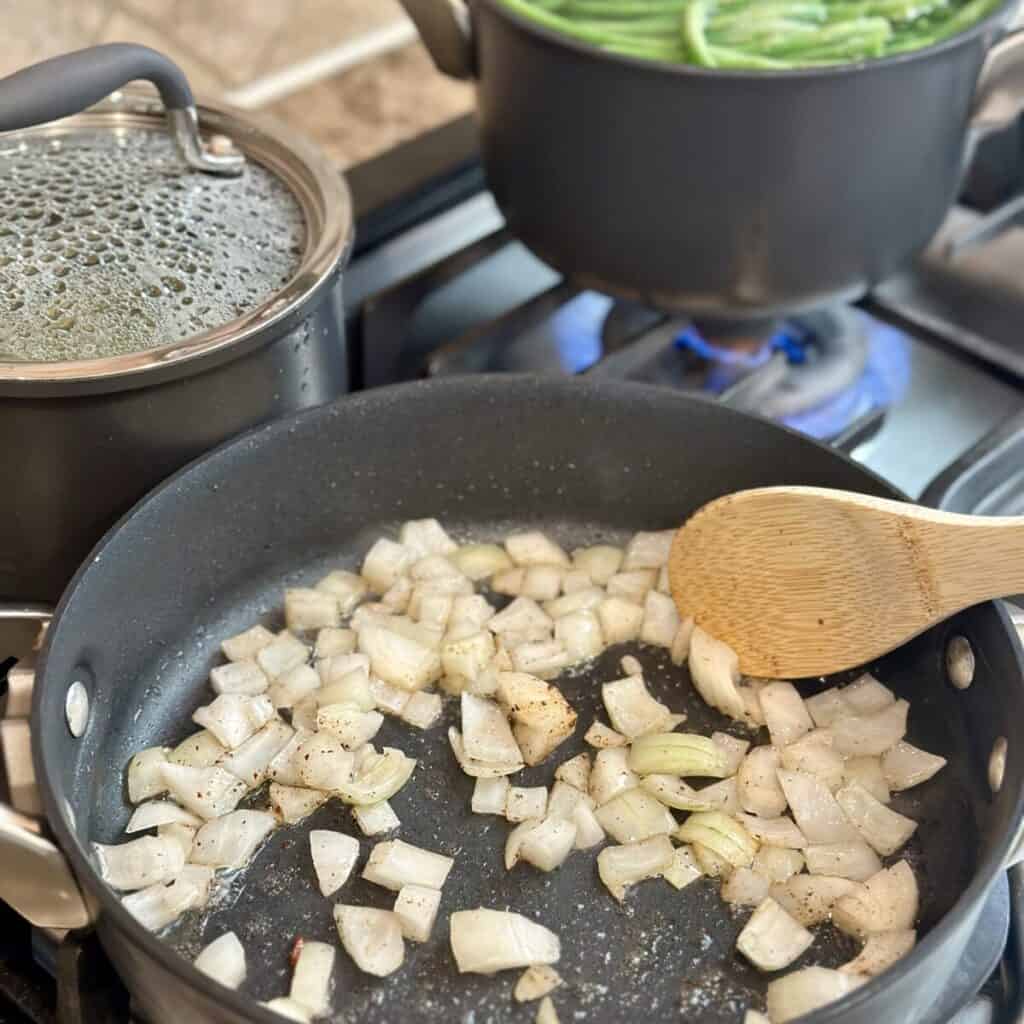 Sautéing onions in a skillet.