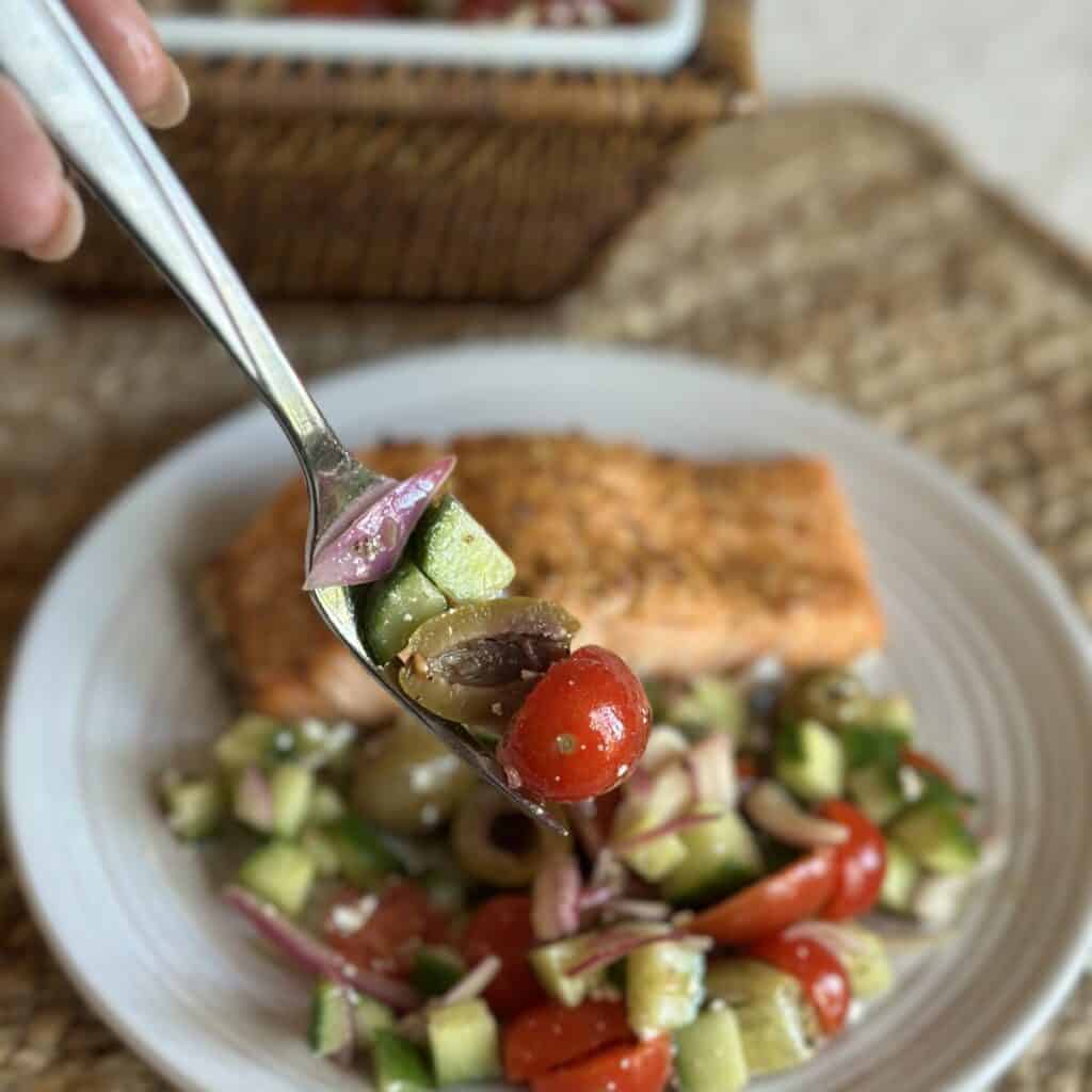 A forkful bite of Mediterranean Cucumber Tomato Salad.