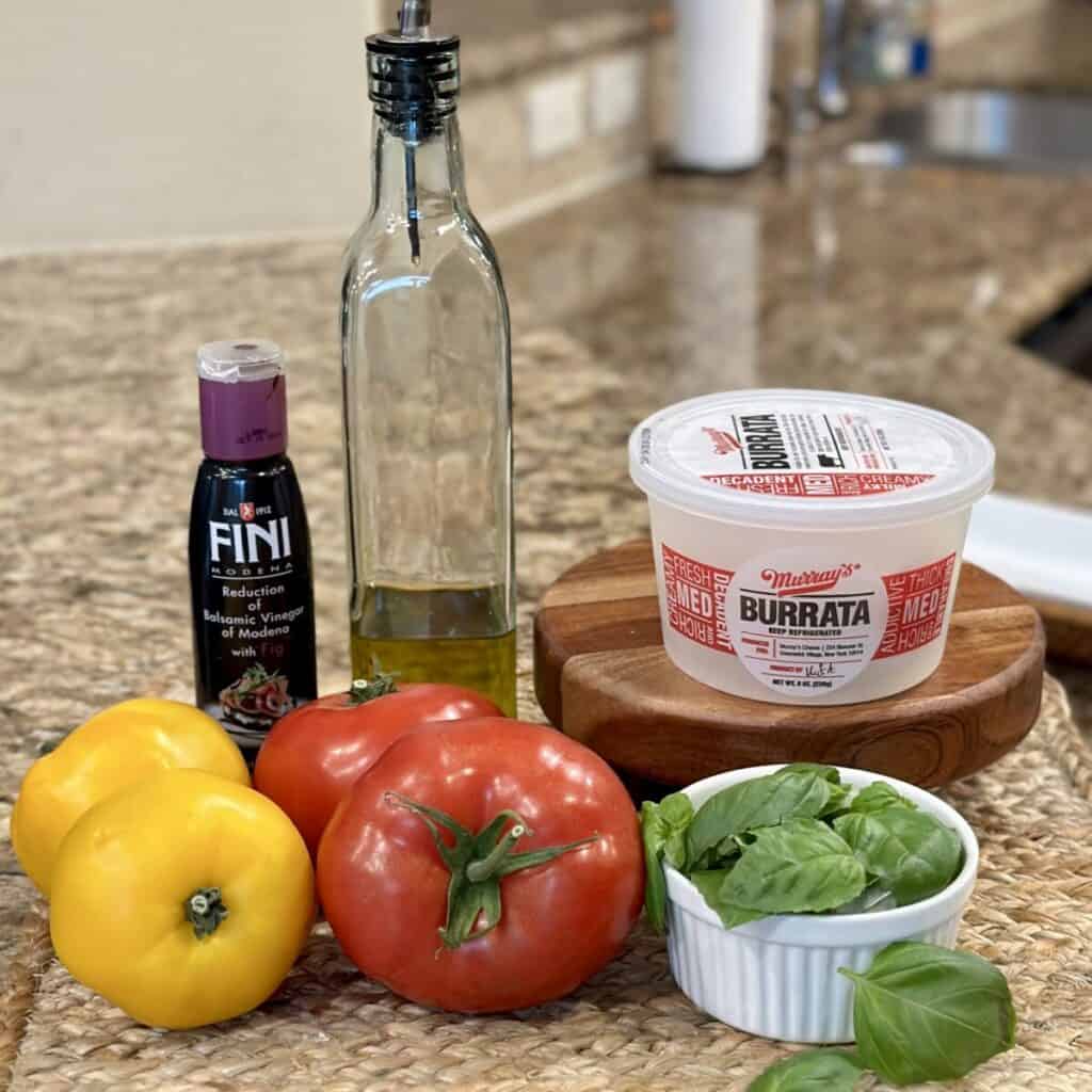 Ingredients to make burrata caprese.