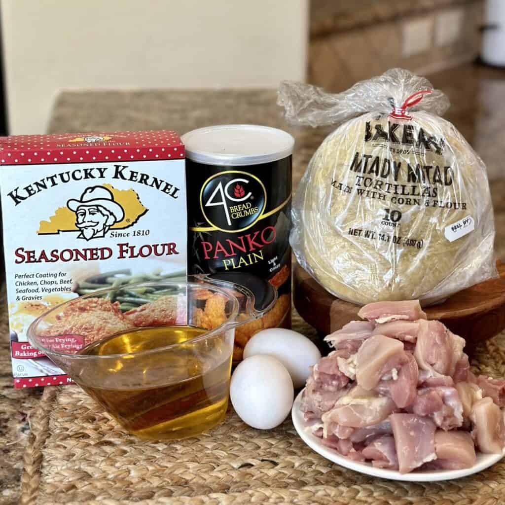 The ingredients to make fried chicken tacos.