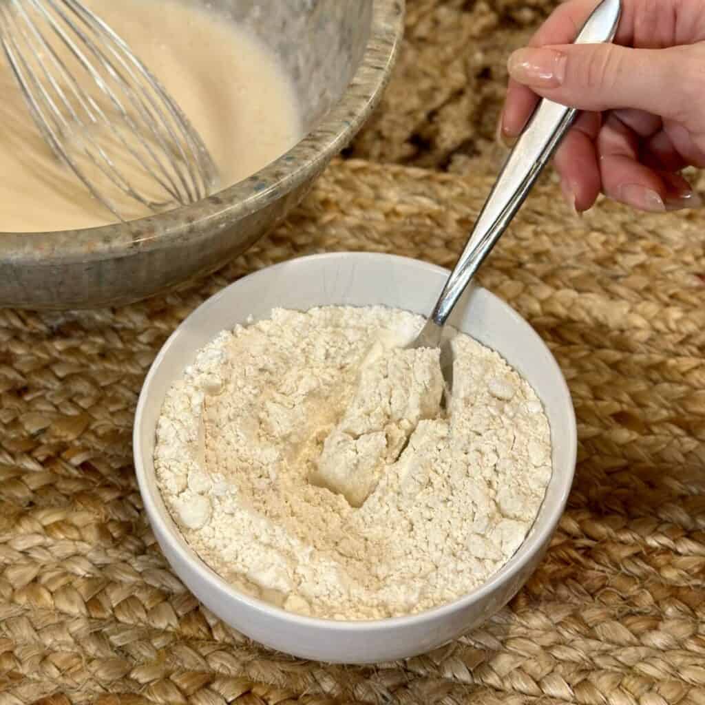 Mixing together dry ingredients for a pound cake. 