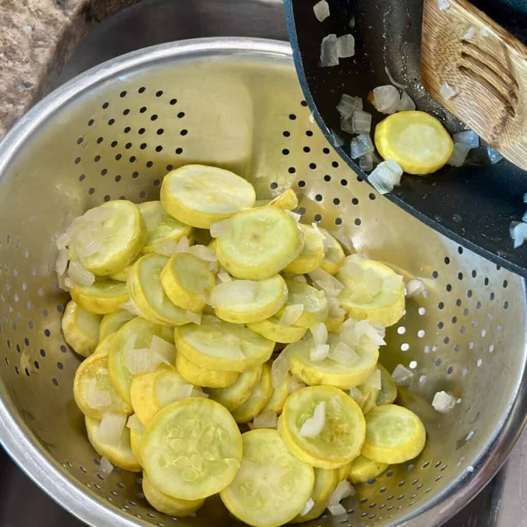 Draining squash in a colander.