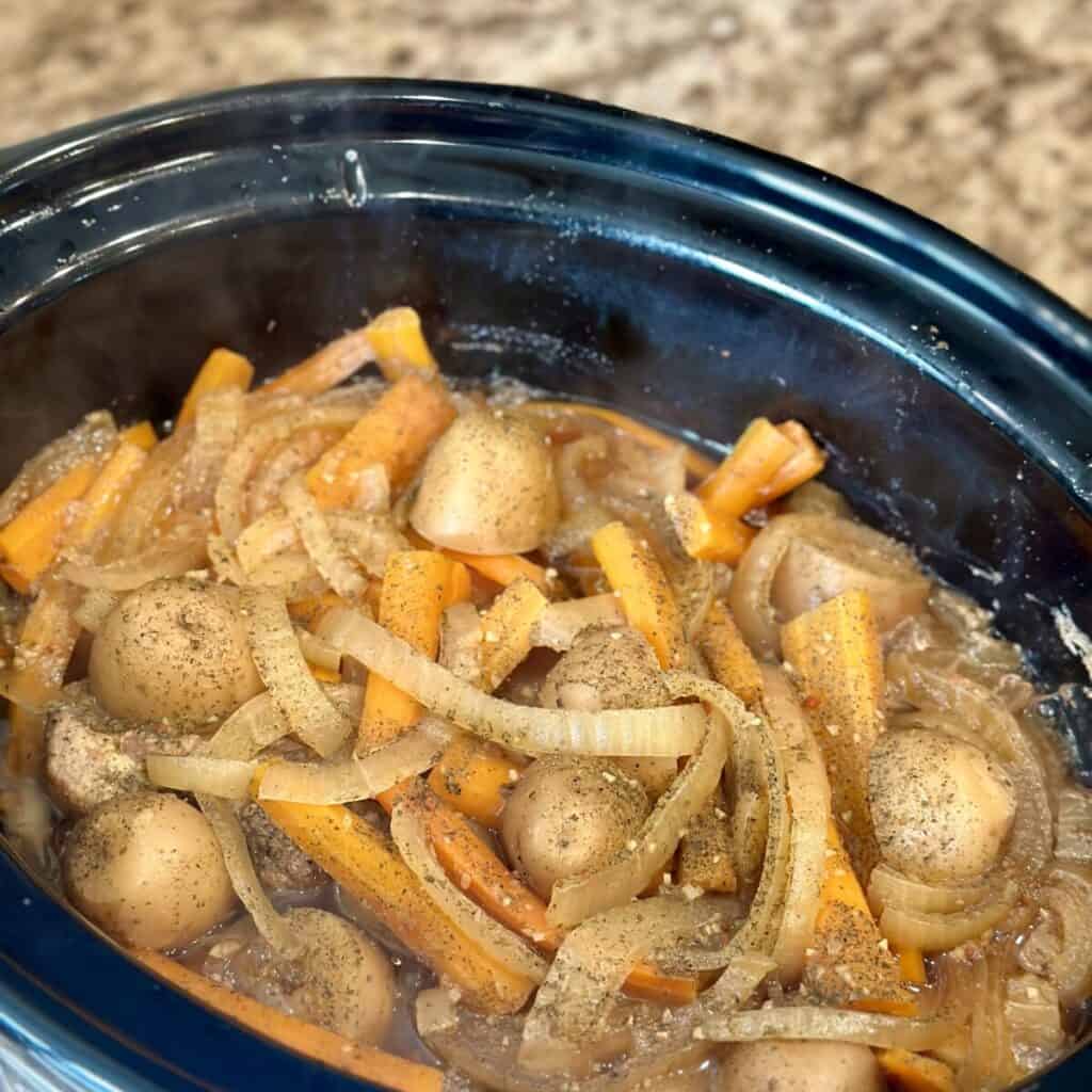 Cooked country style ribs in a slow cooker.