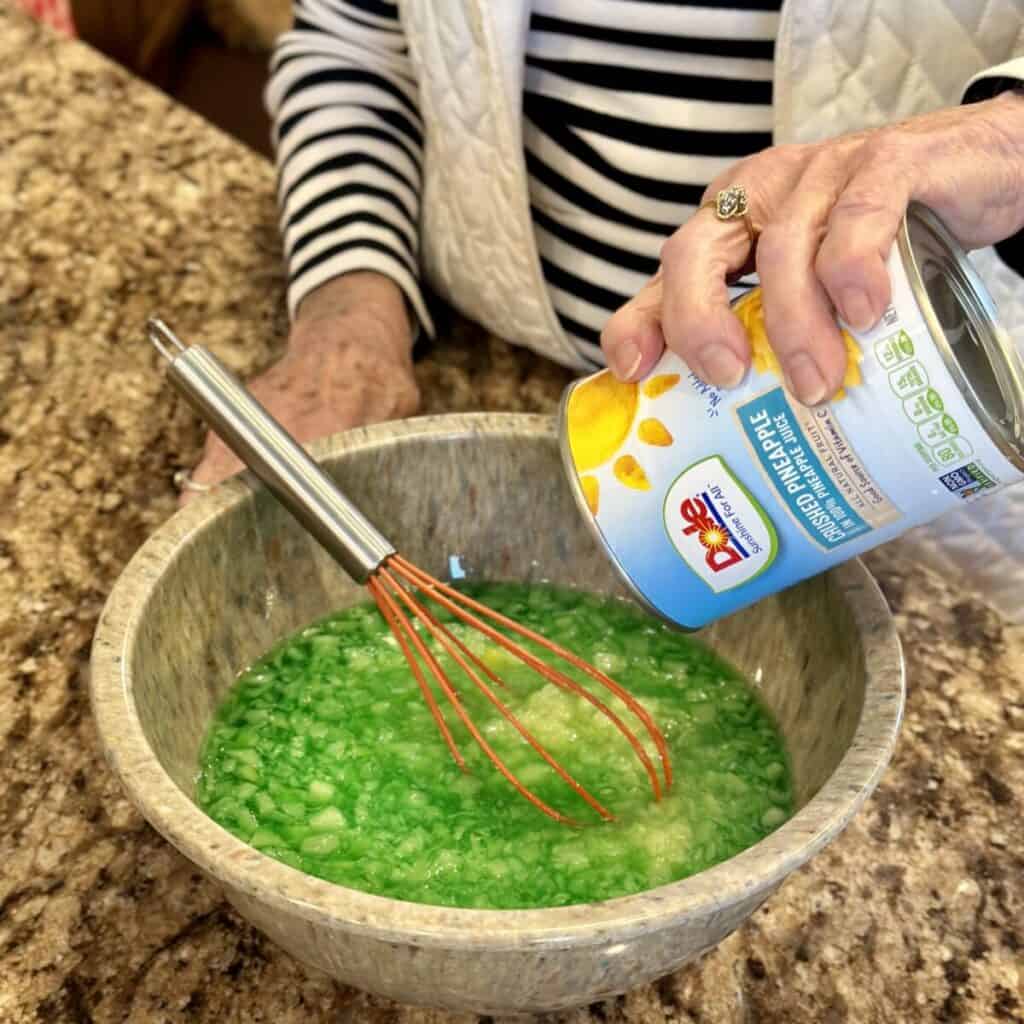 Adding pineapple to jello.