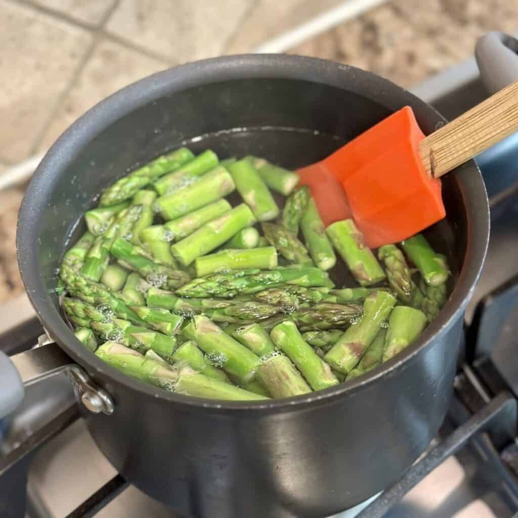 Blanching asparagus.