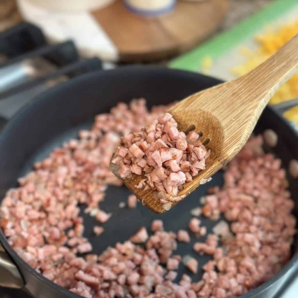 Sautéed ham in a skillet.