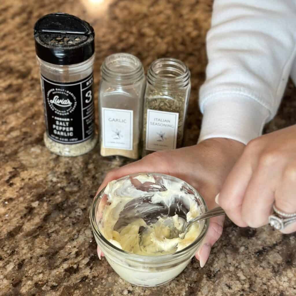 Mixing together garlic butter.